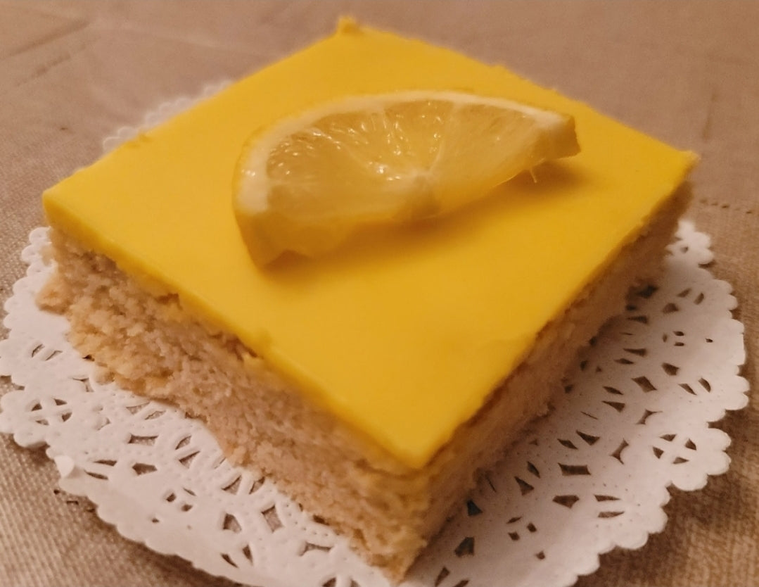 Perfectly portioned keto Iced Lemon Shortbread Bar (2 servings per bar) for easy and healthy eating