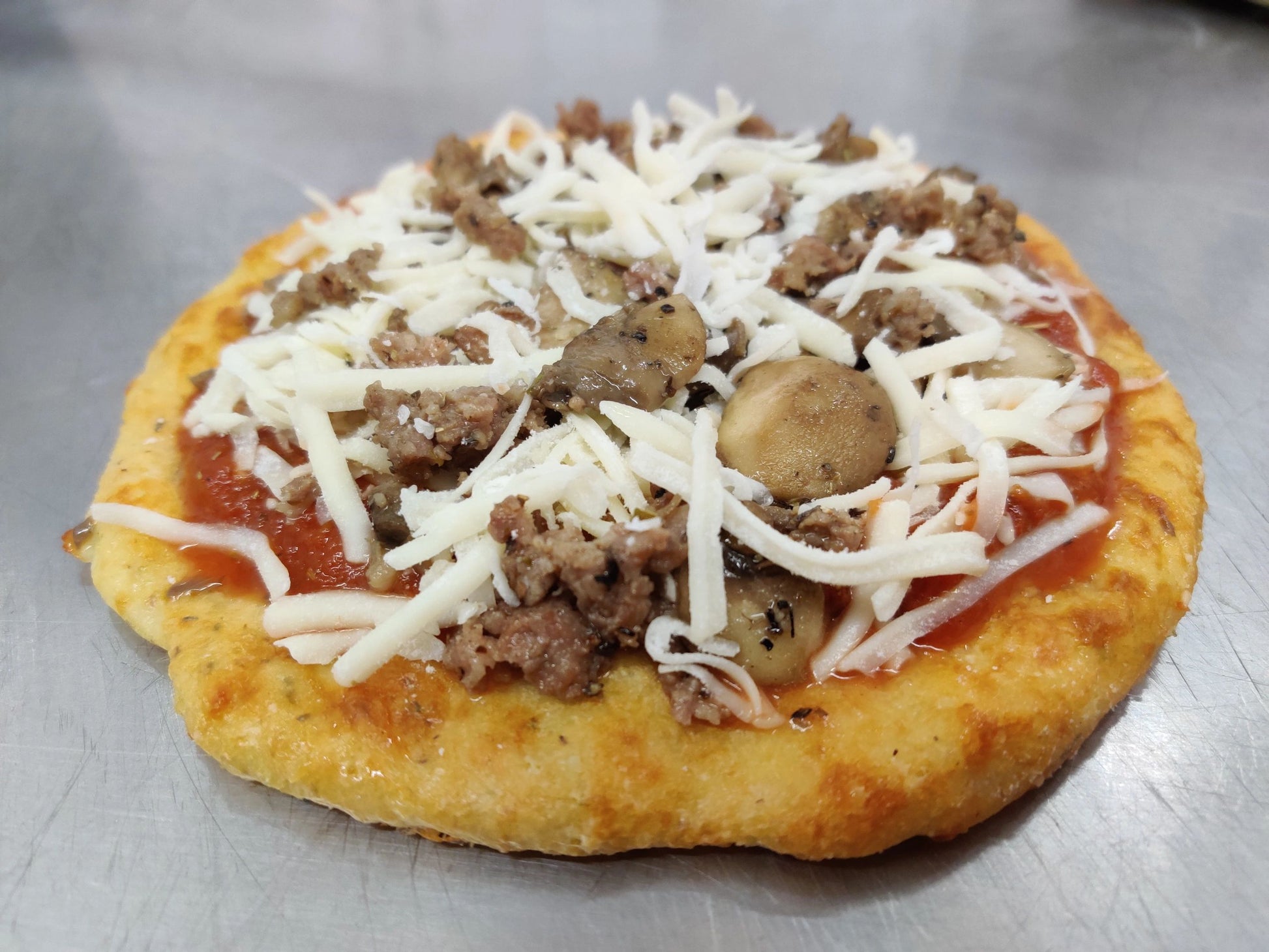 Gourmet keto Sausage & Mushroom Pizza made with premium, all-natural ingredients